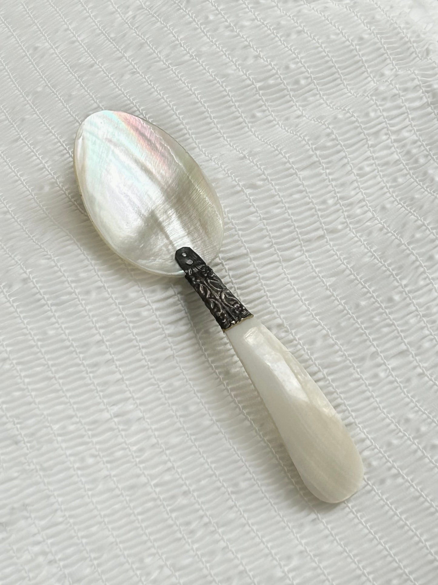 Mother of pearl caviar spoon.