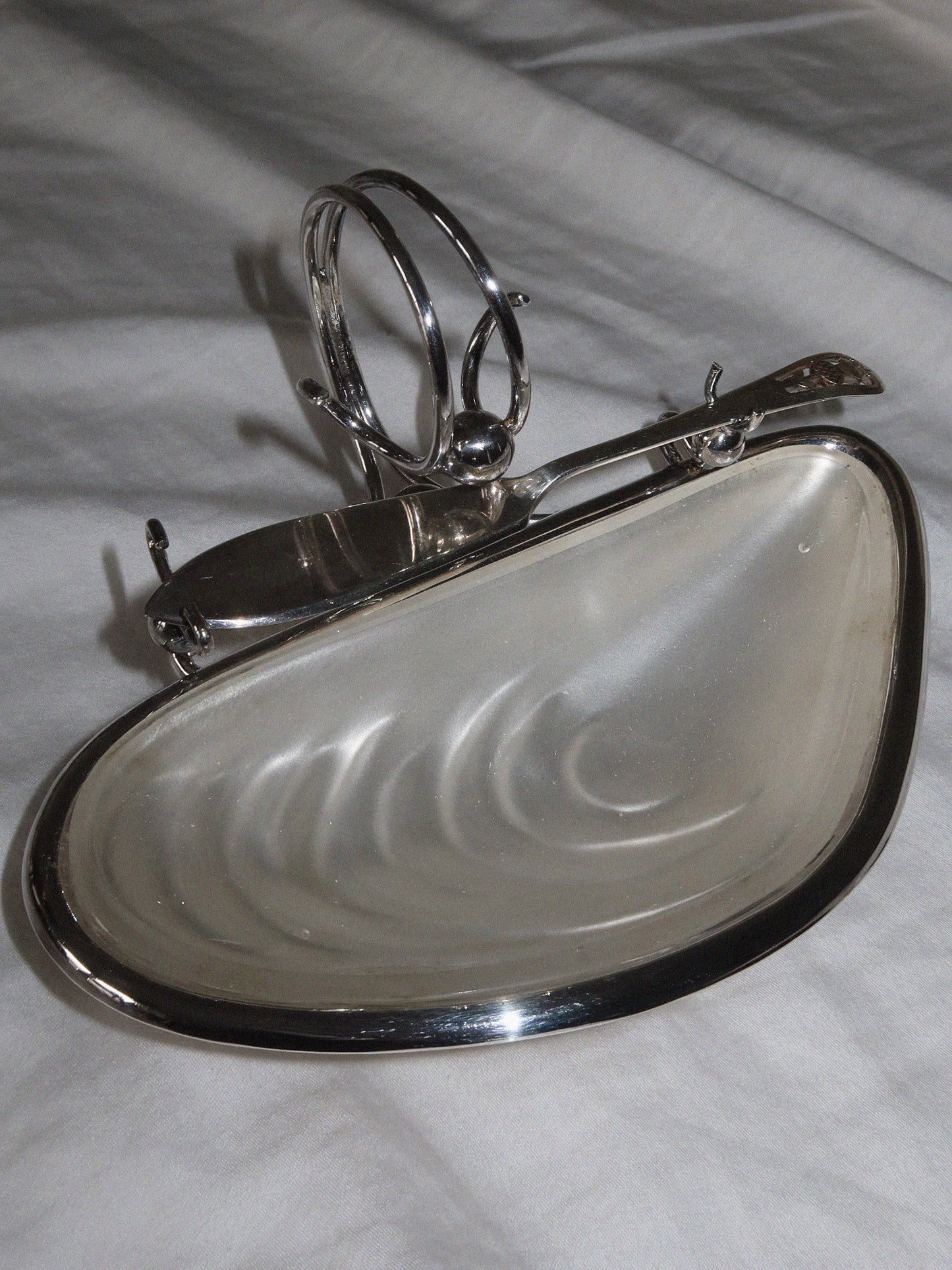 Antique English caviar bowl in silver-plated metal with glass insert.