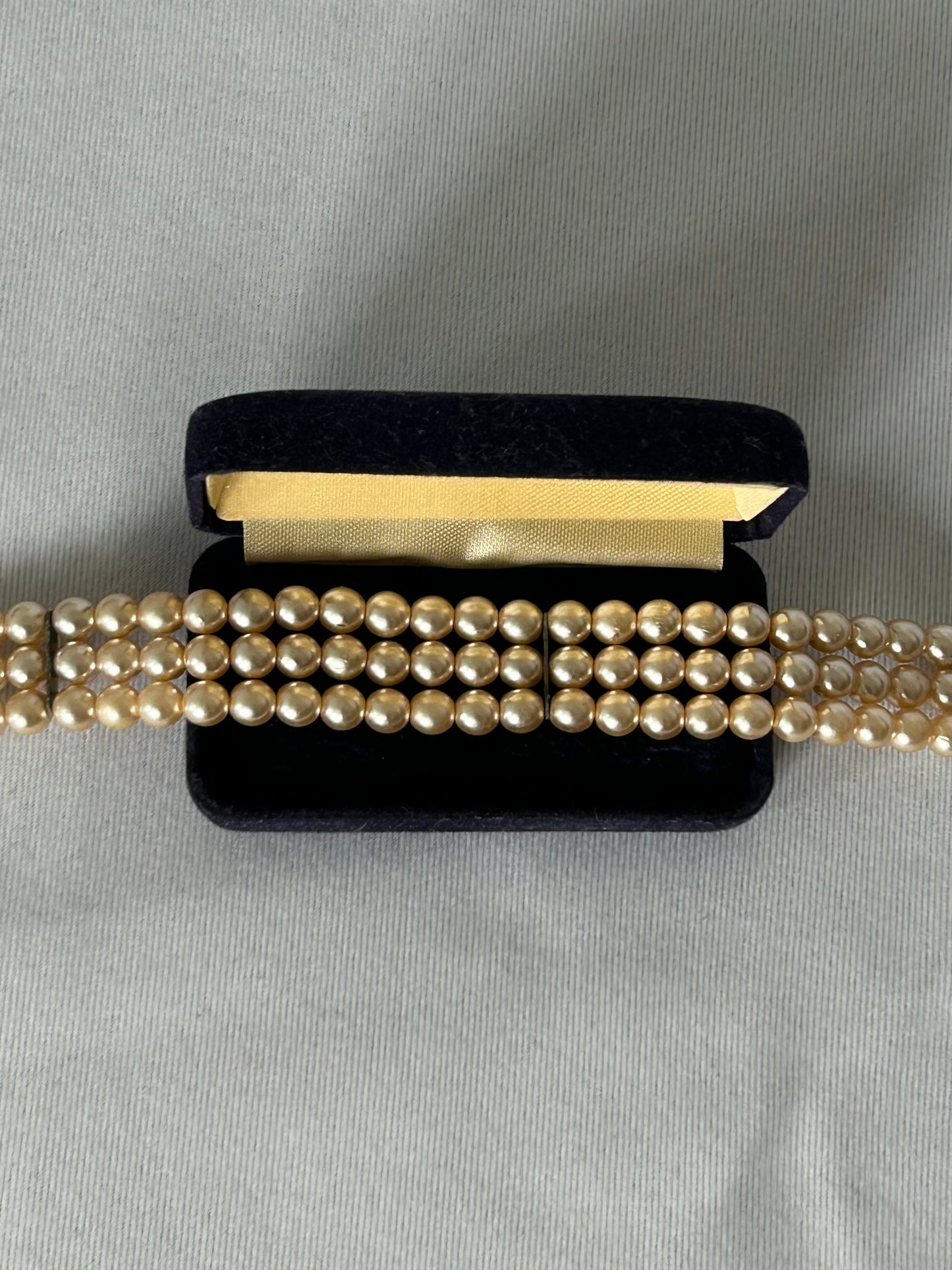 Three-row pearl necklace