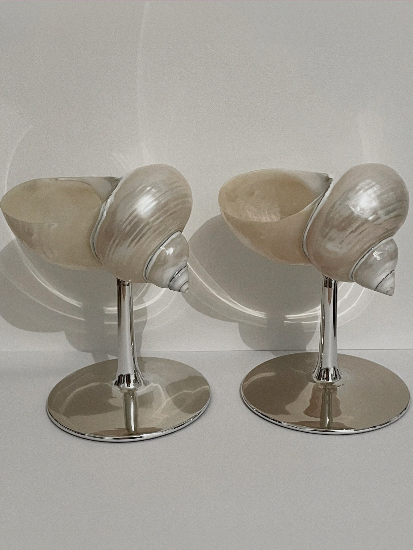 Set of two curly shell glass with silver plated stem.