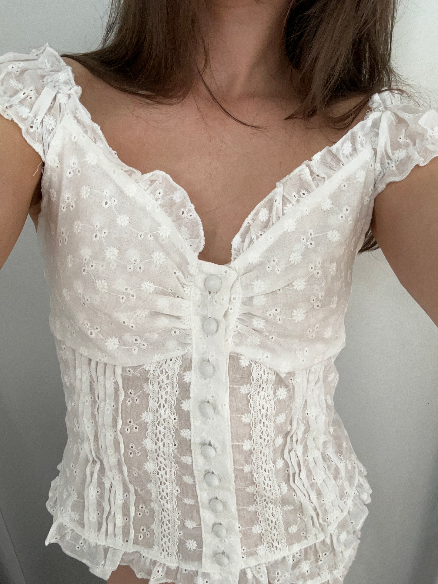 A Ruffle Button Top