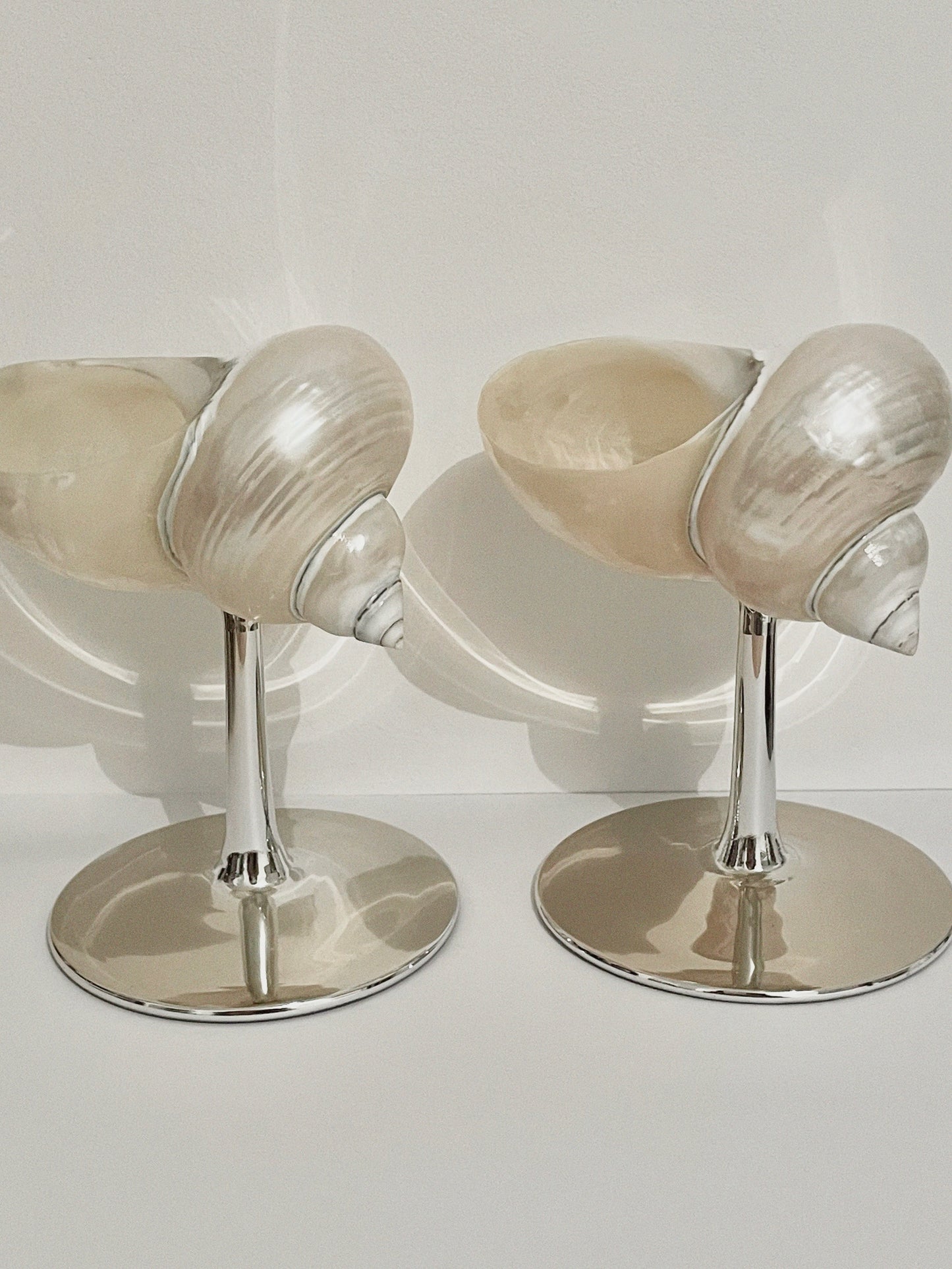 Set of two curly shell glass with silver plated stem.